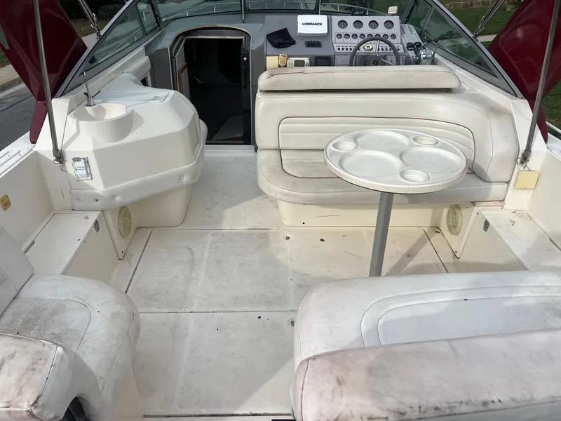 Slide: The Image of 1991 Cruisers Yachts Rouge 33 boat interior with seating and table. - 10
