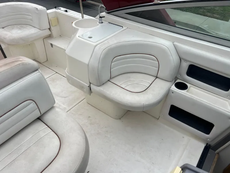Slide: The Image of 1991 Cruisers Yachts Rouge 33 interior seating and helm area. - 16