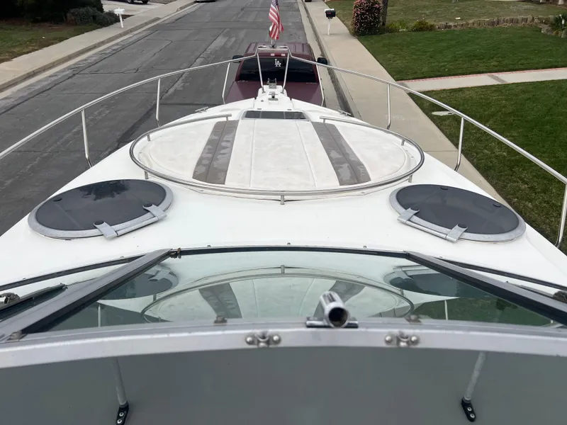 Slide: The Image of 1991 Cruisers Yachts Rouge 33 boat deck view with hatches and railings. - 20