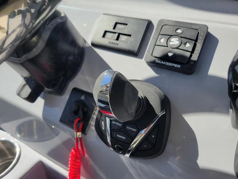 Slide: The Image of Key West 291 FS 2025 boat control panel with joystick and Seakeeper system. - 19
