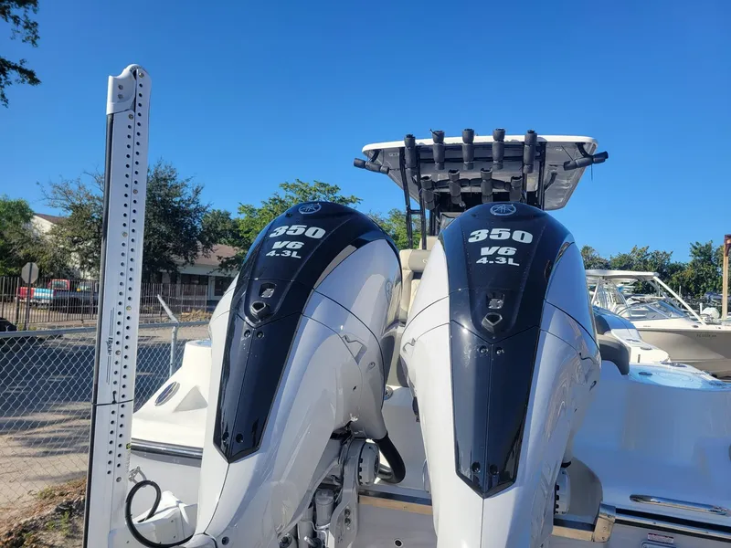 Slide: The Image of 2025 Key West 291 FS boat with dual 350 V6 4.3L engines. - 20