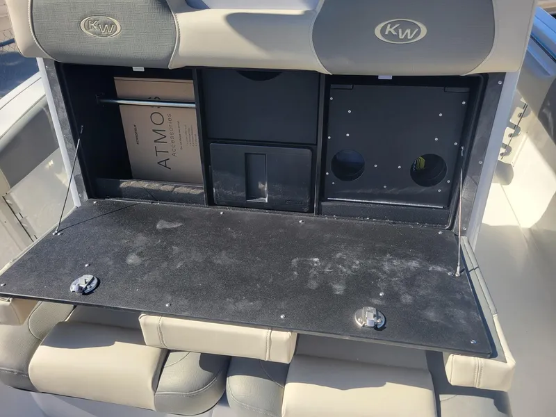 Slide: The Image of 2025 Key West 291 FS boat storage compartment with seating and storage features. - 9