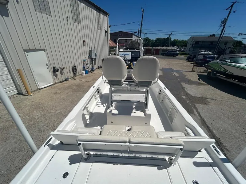 Slide: The Image of 2019 Blue Wave 2400 PureBay boat interior with seating and console. - 13