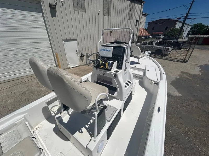 Slide: The Image of 2019 Blue Wave 2400 PureBay boat with dual seats and navigation system. - 16