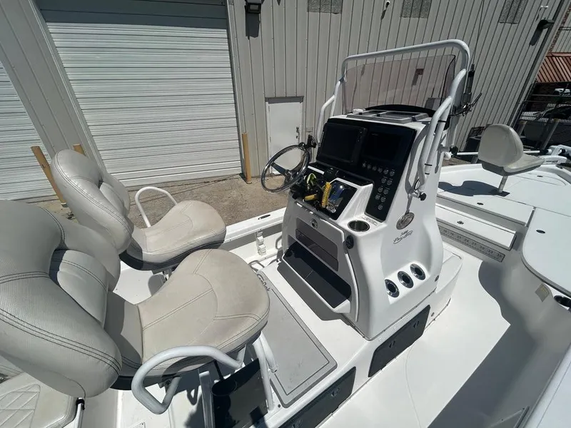 Slide: The Image of 2019 Blue Wave 2400 PureBay boat interior with dual seats and control console. - 17
