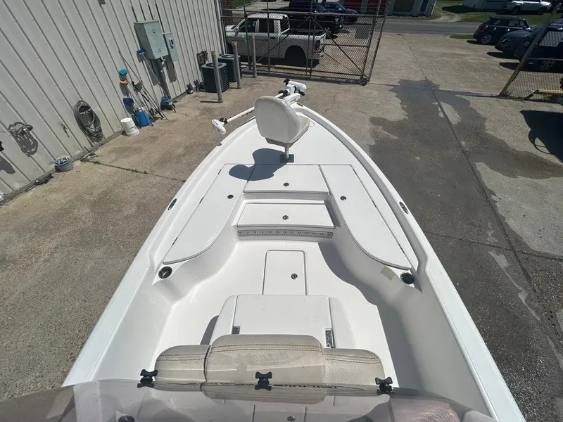 Slide: The Image of 2019 Blue Wave 2400 PureBay boat, front deck view, parked on concrete. - 21