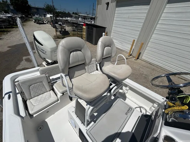 Slide: The Image of 2019 Blue Wave 2400 PureBay boat with dual captain's chairs and rear seating. - 30