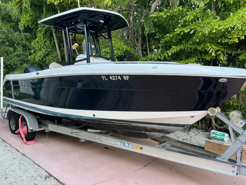 Slide: The Image of 2018 Robalo R242 Center Console boat on a trailer. - 1