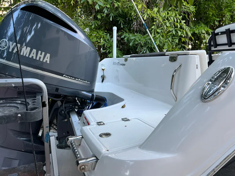 Slide: The Image of 2018 Robalo R242 Center Console boat with Yamaha outboard motor. - 11
