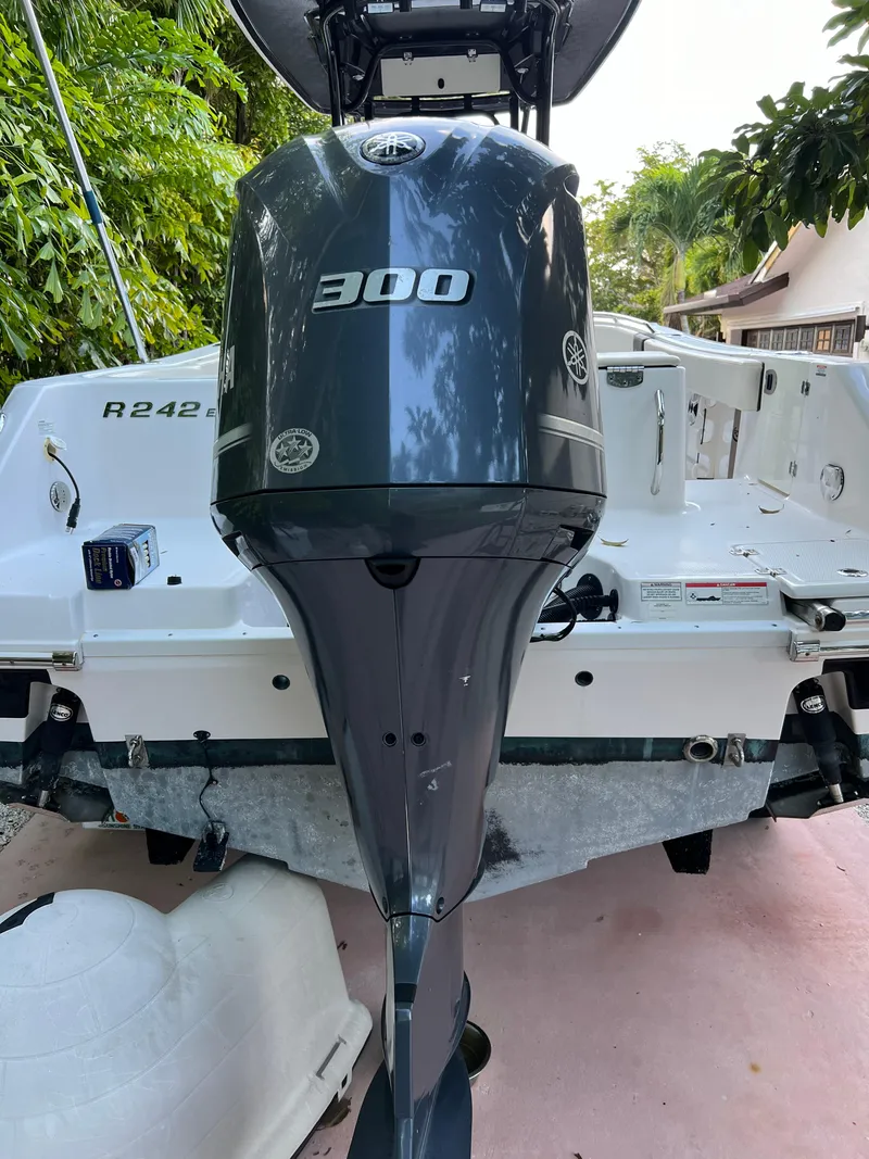 Slide: The Image of 2018 Robalo R242 Center Console boat with 300 HP engine, rear view. - 13