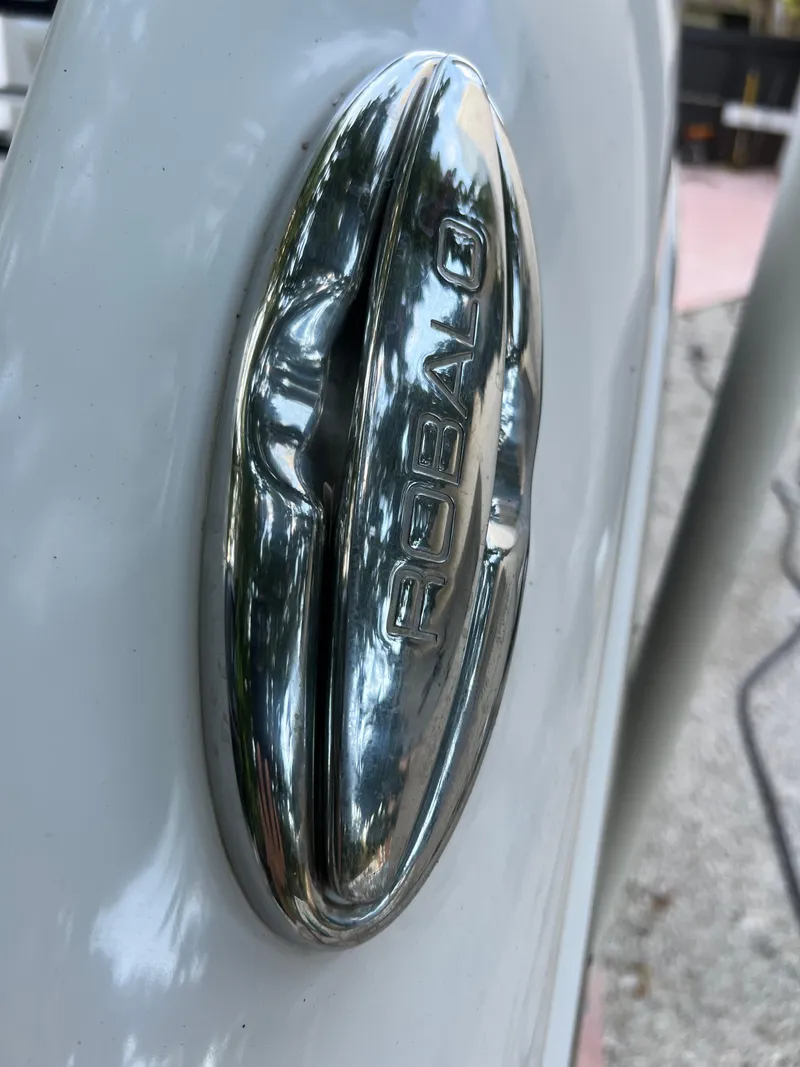 Slide: The Image of Close-up of 2018 Robalo R242 Center Console boat logo. - 22