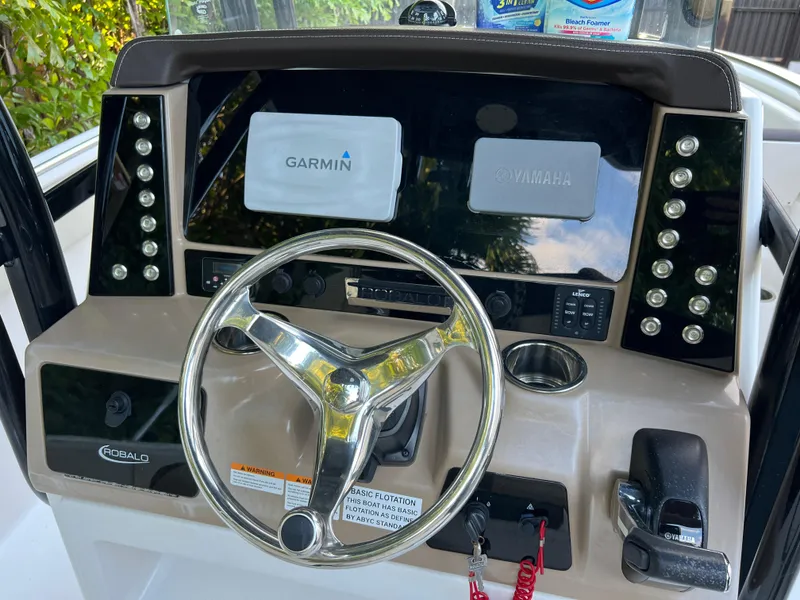 Slide: The Image of 2018 Robalo R242 Center Console helm with Garmin and Yamaha displays. - 26