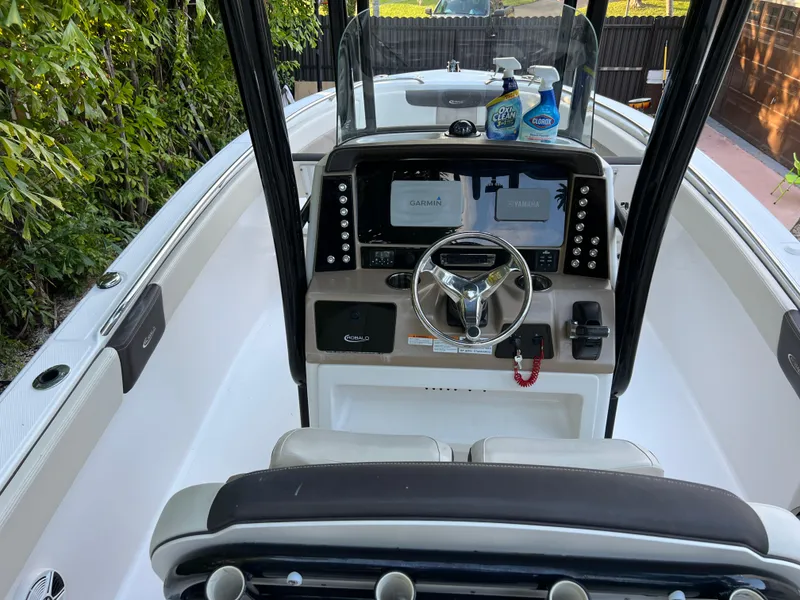 Slide: The Image of 2018 Robalo R242 Center Console boat interior with steering wheel and control panel. - 27