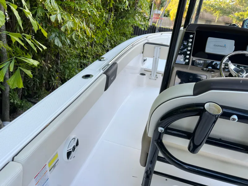 Slide: The Image of 2018 Robalo R242 Center Console boat interior with steering console and seating. - 29