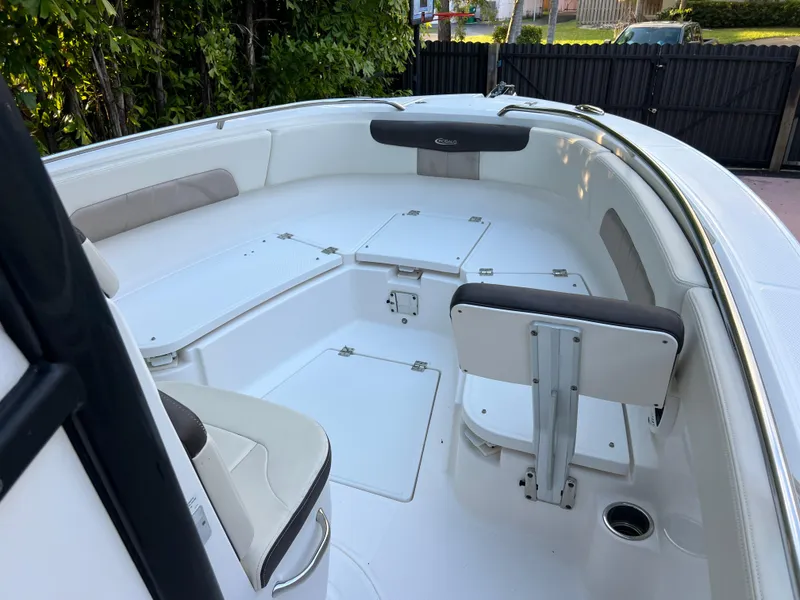 Slide: The Image of 2018 Robalo R242 Center Console boat interior with seating and storage compartments. - 31