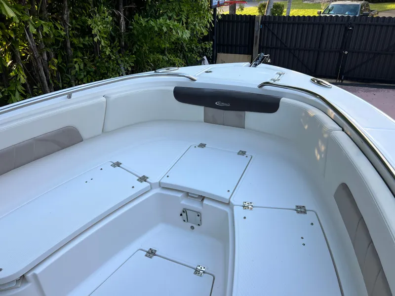 Slide: The Image of 2018 Robalo R242 Center Console boat with spacious bow seating and storage compartments. - 32