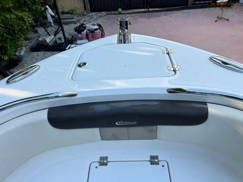 Slide: The Image of 2018 Robalo R242 Center Console boat bow with storage compartments. - 37