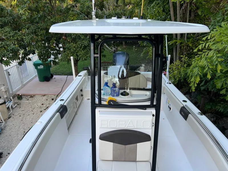 Slide: The Image of 2018 Robalo R242 Center Console boat with T-top and seating. - 38