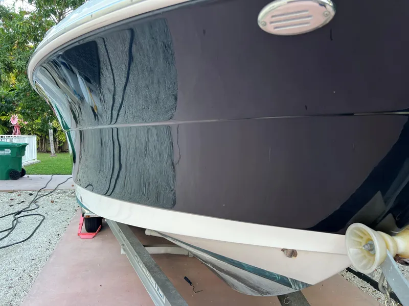 Slide: The Image of 2018 Robalo R242 Center Console boat on trailer, side view. - 4