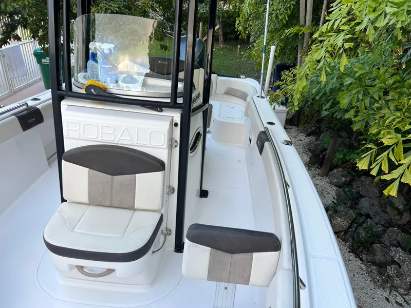 Slide: The Image of 2018 Robalo R242 Center Console boat interior with seating and console. - 40
