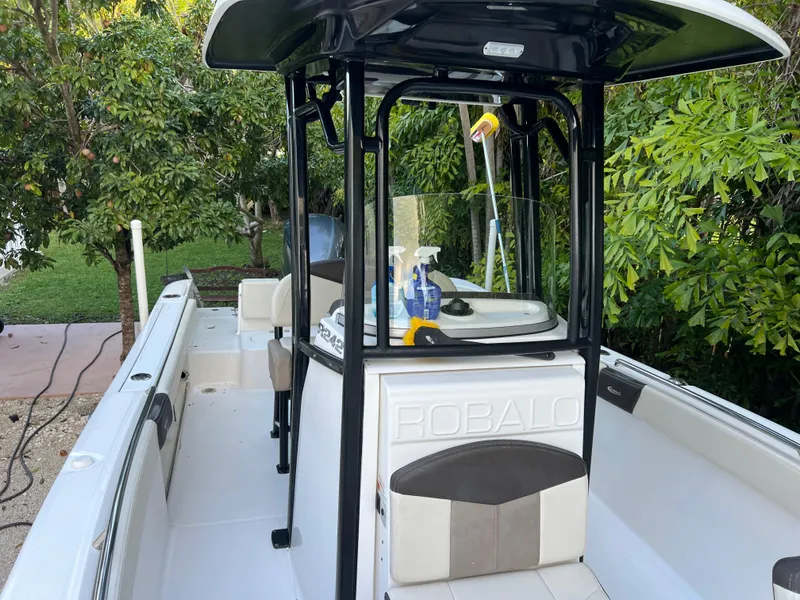 Slide: The Image of 2018 Robalo R242 Center Console boat with cleaning supplies on deck. - 41
