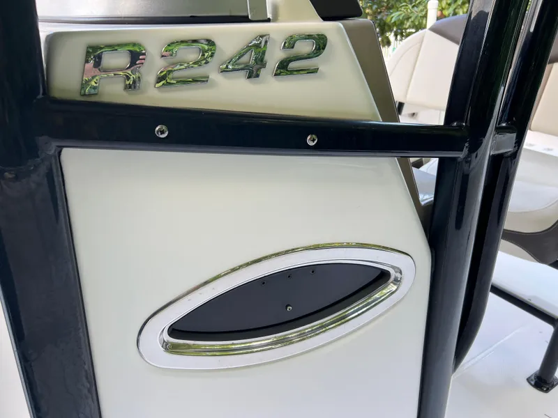 Slide: The Image of 2018 Robalo R242 Center Console boat detail with model emblem. - 46