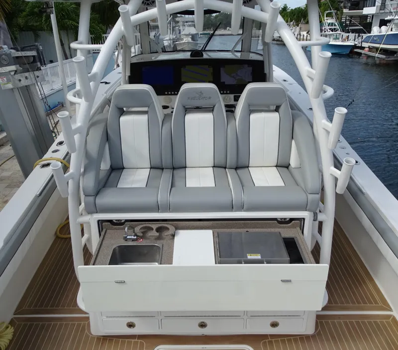 Slide: The Image of 2022 Regulator 41 boat interior with seating and fishing rod holders. - 16