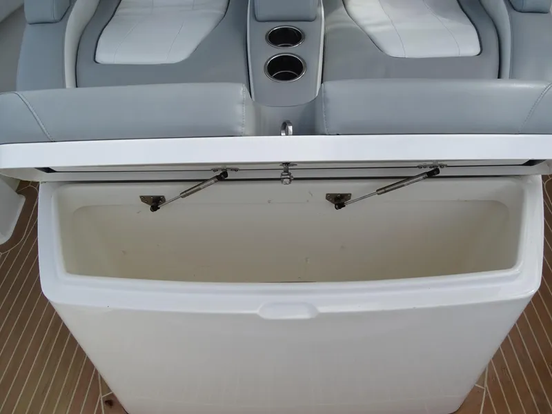 Slide: The Image of 2022 Regulator 41 boat seat with storage compartment and cup holders. - 30