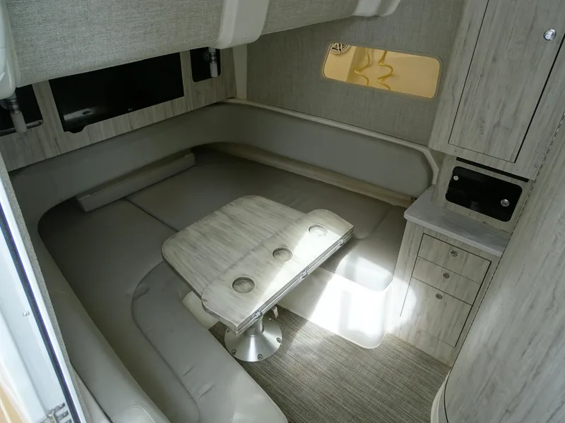 Slide: The Image of 2022 Regulator 41 cabin interior with seating, table, and cabinetry. - 31
