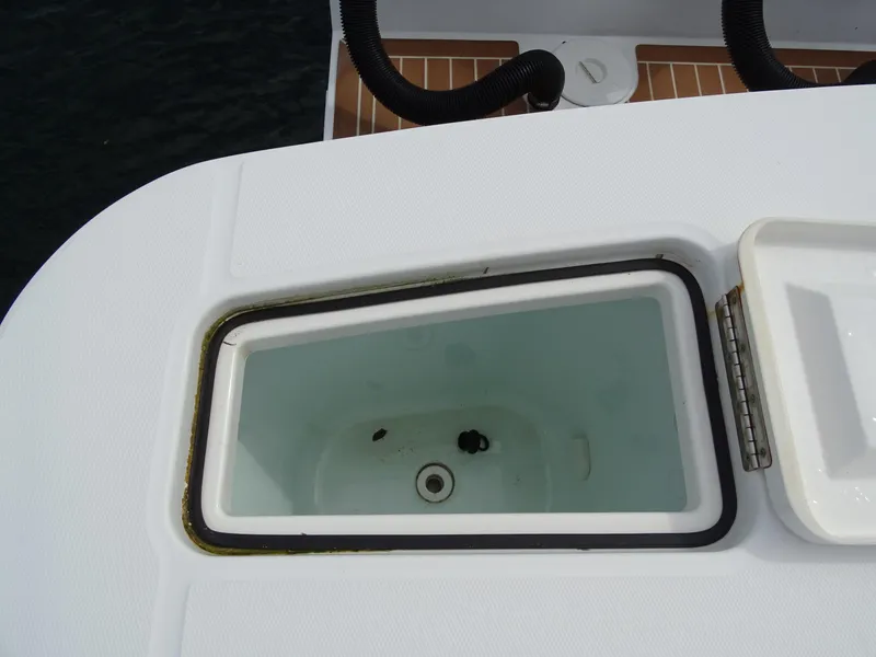 Slide: The Image of Open storage compartment on 2022 Regulator 41 boat deck. - 37