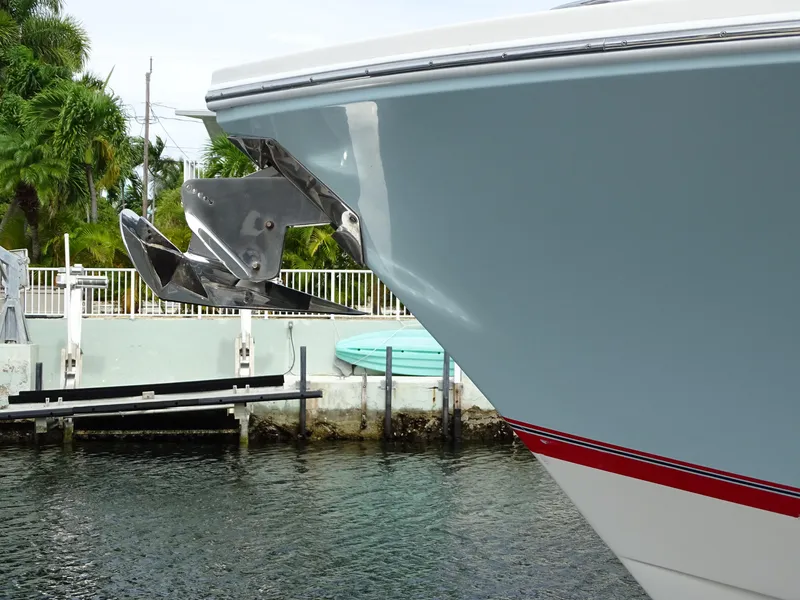 Slide: The Image of 2022 Regulator 41 boat bow with anchor, docked near water. - 9