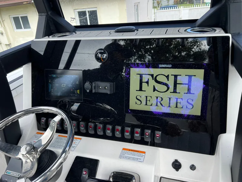 Slide: The Image of Yamaha Boats 2021 FSH 255 Sport E dashboard with steering wheel and control panel. - 16