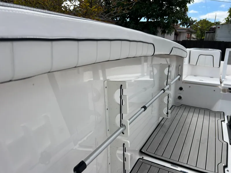 Slide: The Image of 2021 Yamaha Boats FSH 255 Sport E interior, showing seating and deck details. - 18