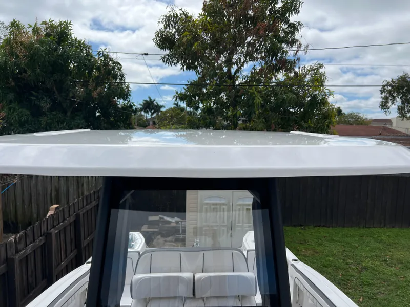 Slide: The Image of 2021 Yamaha Boats FSH 255 Sport E, view of the boat's top and seating area. - 22