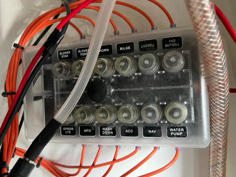 Slide: The Image of Control panel of a 2021 Yamaha Boats FSH 255 Sport E with labeled switches. - 23