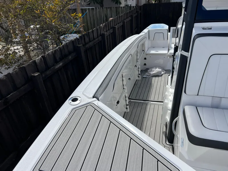Slide: The Image of 2021 Yamaha Boats FSH 255 Sport E interior with sleek seating and modern design. - 29
