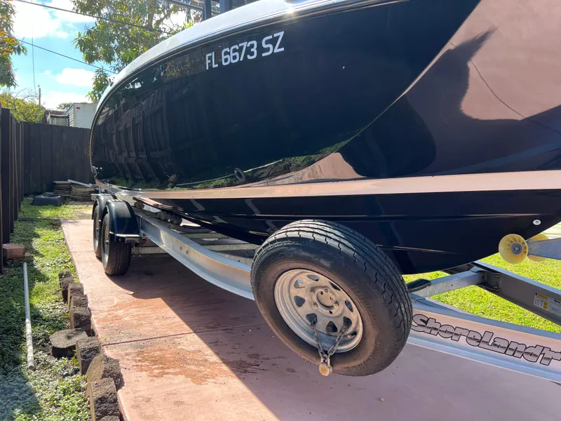 Slide: The Image of 2021 Yamaha Boats FSH 255 Sport E on trailer, side view. - 5