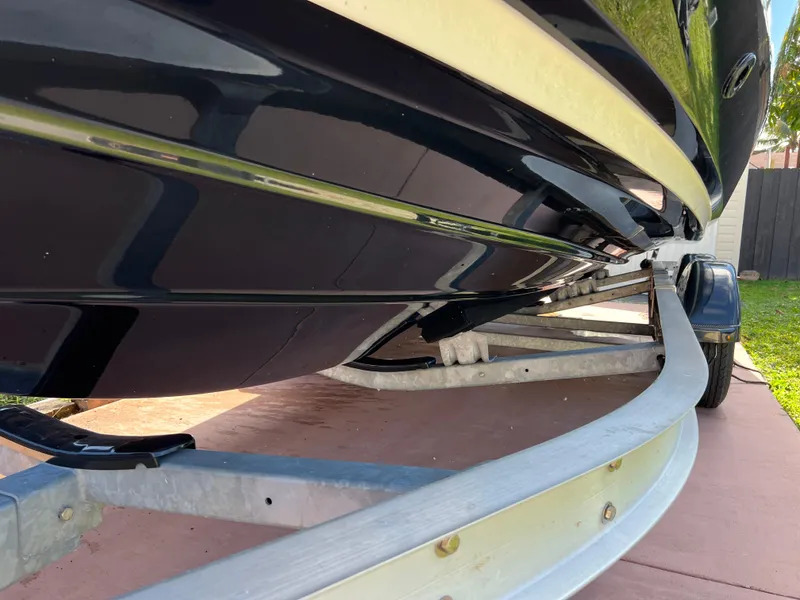Slide: The Image of 2021 Yamaha Boats FSH 255 Sport E on trailer, close-up view of hull. - 6
