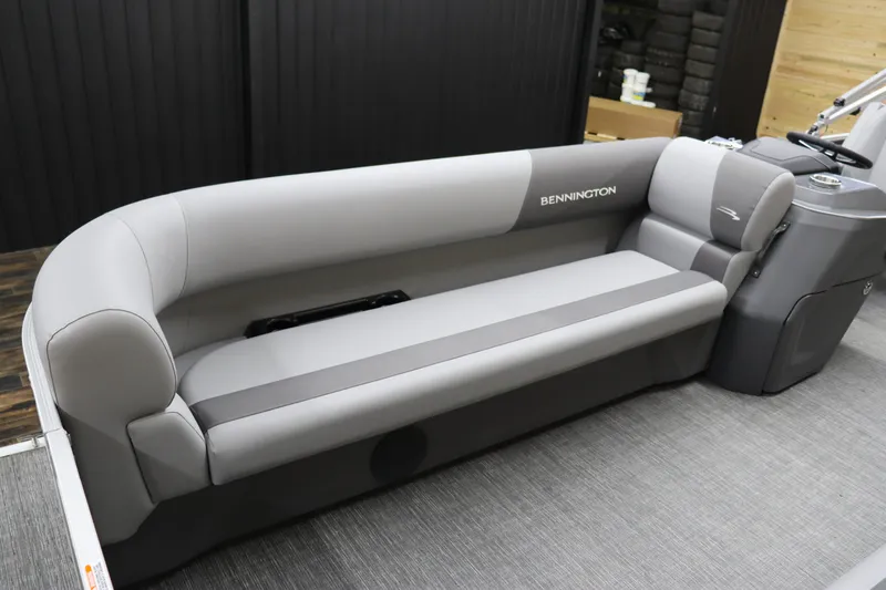 Slide: The Image of 2024 Bennington 22SVL boat interior with gray seating and modern design. - 11