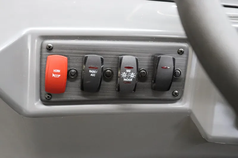 Slide: The Image of Control panel of 2024 Bennington 22SVL boat with horn and accessory switches. - 18