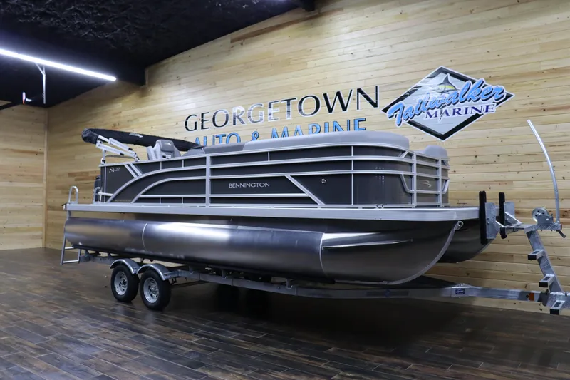 Slide: The Image of 2024 Bennington 22SVL pontoon boat on trailer at Georgetown Auto & Marine showroom. - 2