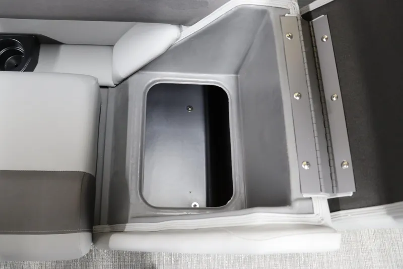 Slide: The Image of 2024 Bennington 22SVL storage compartment with gray and white seating. - 23