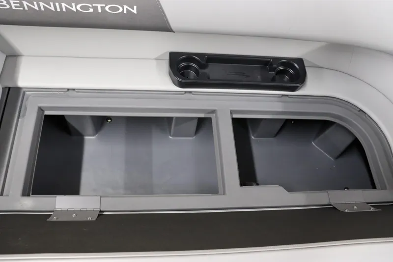 Slide: The Image of Bennington 22SVL 2024 boat storage compartments and cup holders. - 28