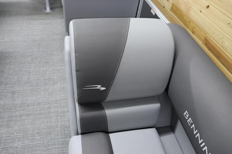 Slide: The Image of 2024 Bennington 22SVL boat seat with gray upholstery and logo. - 29