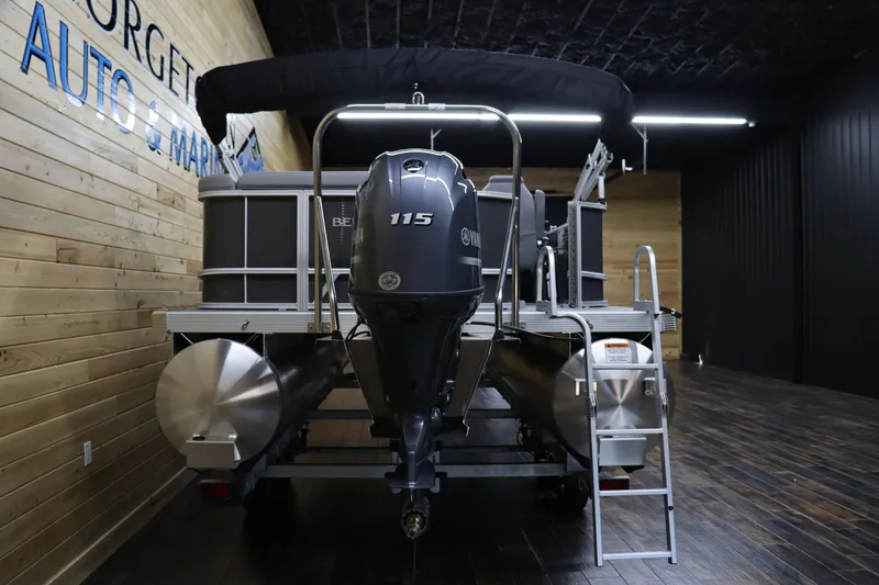 Slide: The Image of 2024 Bennington 22SVL pontoon boat with 115 HP engine in showroom. - 4