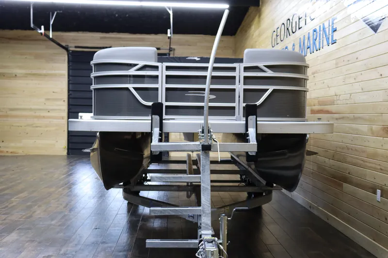 Slide: The Image of 2024 Bennington 22SVL pontoon boat on trailer in showroom. - 8