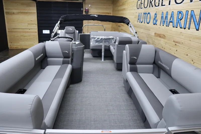 Slide: The Image of 2024 Bennington 22SVL pontoon boat interior with gray seating. - 9