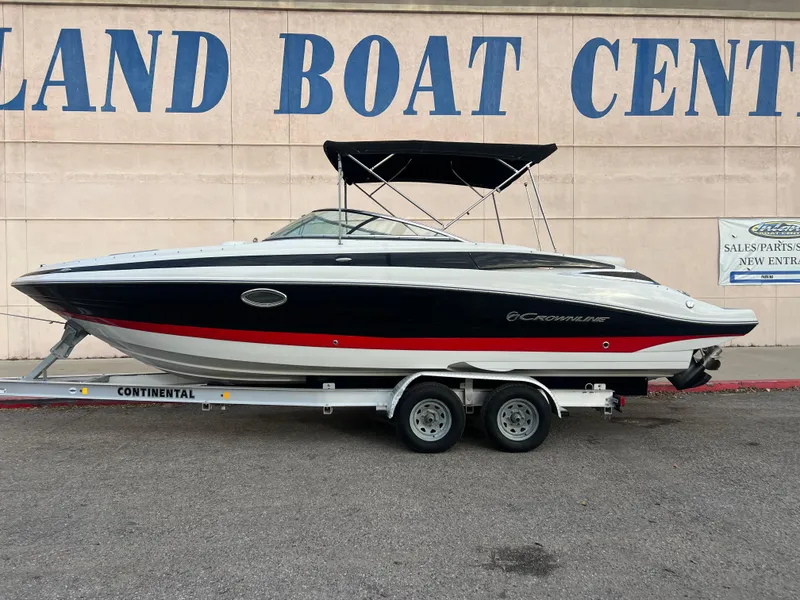 The Image of 2016 Crownline 270 SS boat on a trailer at a boat center. - 1