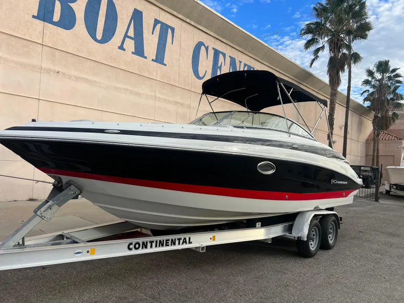 Slide: The Image of 2016 Crownline 270 SS boat on a Continental trailer at a boat center. - 25