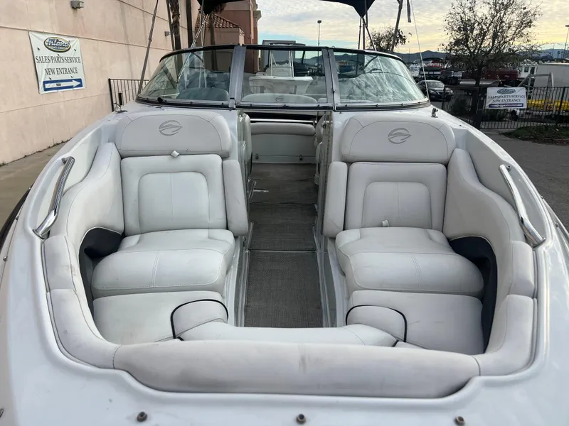 Slide: The Image of 2016 Crownline 270 SS boat with white leather seating and open deck. - 26